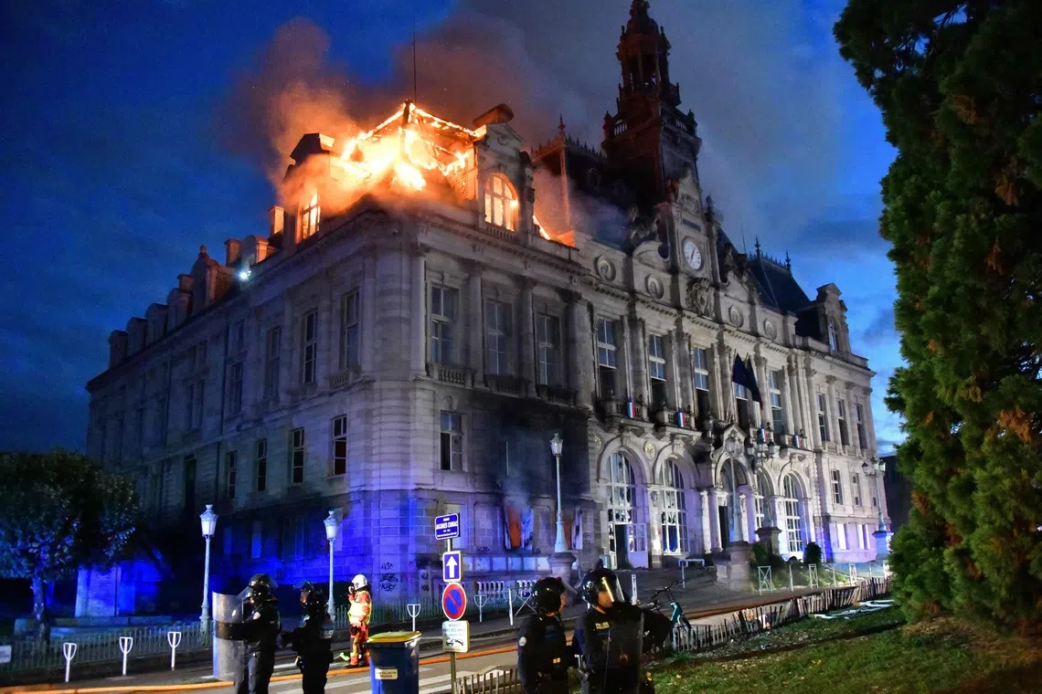 A fire burning at the city hall after a group of individuals forced entry into the building during ongoing protest action against the “high cost of living”, on Oct 17.