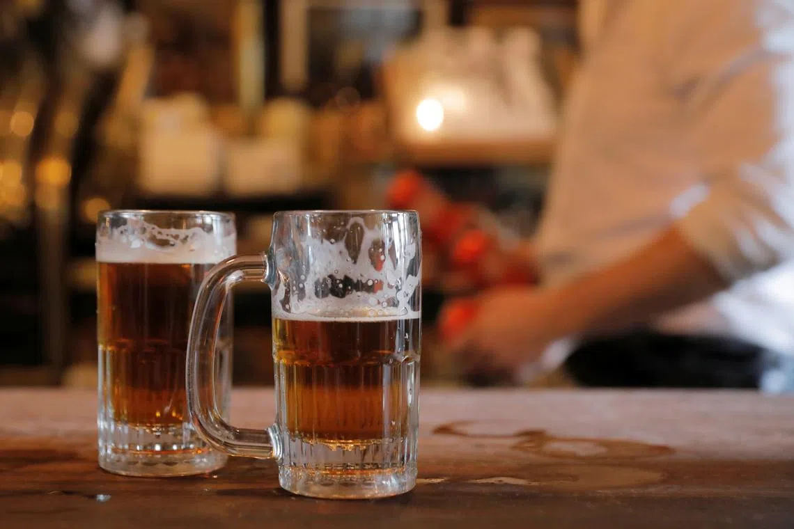 FILE PHOTO: Beer sits on the bar at McSorley's Old Ale House in Manhattan, New York City, New York, U.S., May 3, 2021. REUTERS/Andrew Kelly/File Photo