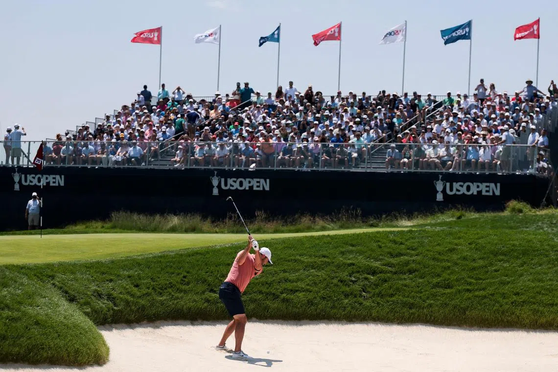 Scottie Scheffler of the United States playing a shot from the bunker on the 13th hole, during a practice round prior to the US Open, on June 11.