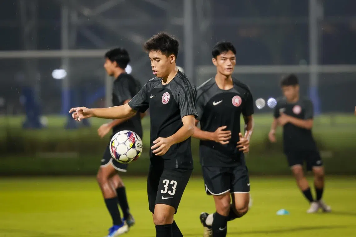 Young Lions' Fairuz Fazli (centre) and Raoul Suhaimi (right) at a training session at Kallang Football Hub on June 14, 2024.