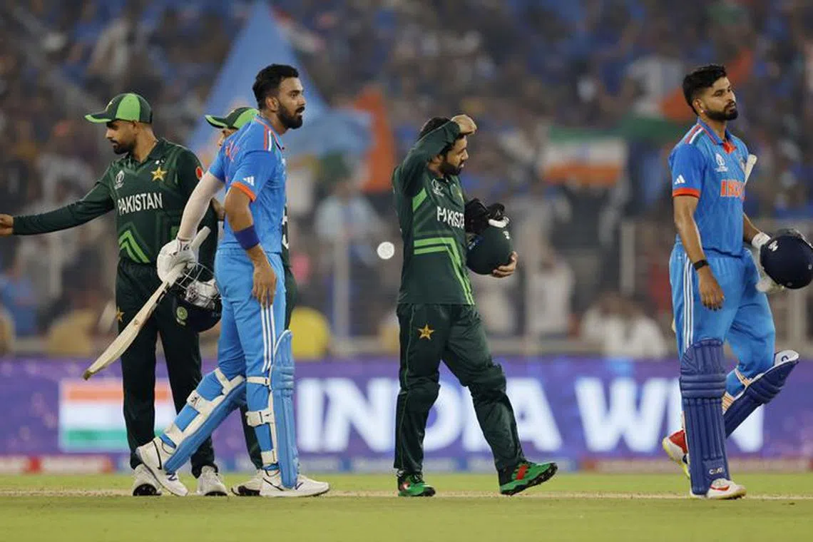 Cricket - ICC Cricket World Cup 2023 - India v Pakistan - Narendra Modi Stadium, Ahmedabad, India - October 14, 2023 India's KL Rahul and Shreyas Iyer as the players shake hands after the match REUTERS/Adnan Abidi
