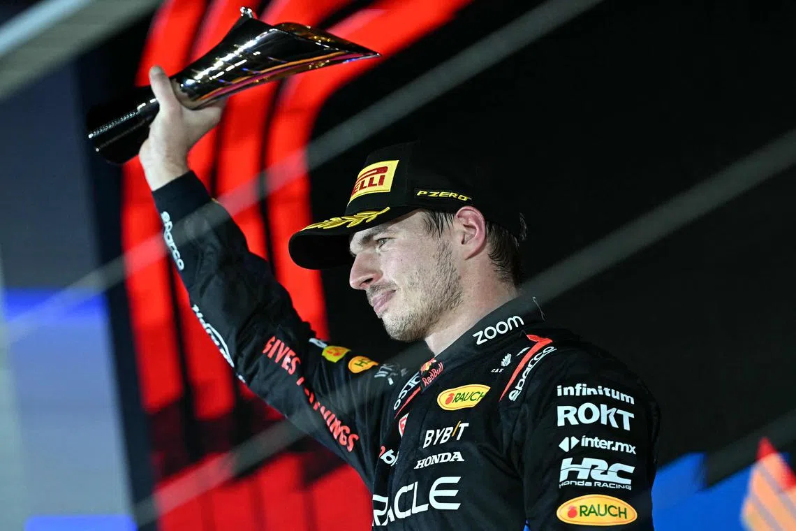 Second placed Red Bull Racing's Dutch driver Max Verstappen celebrates on the podium after the Formula One Singapore Grand Prix.
