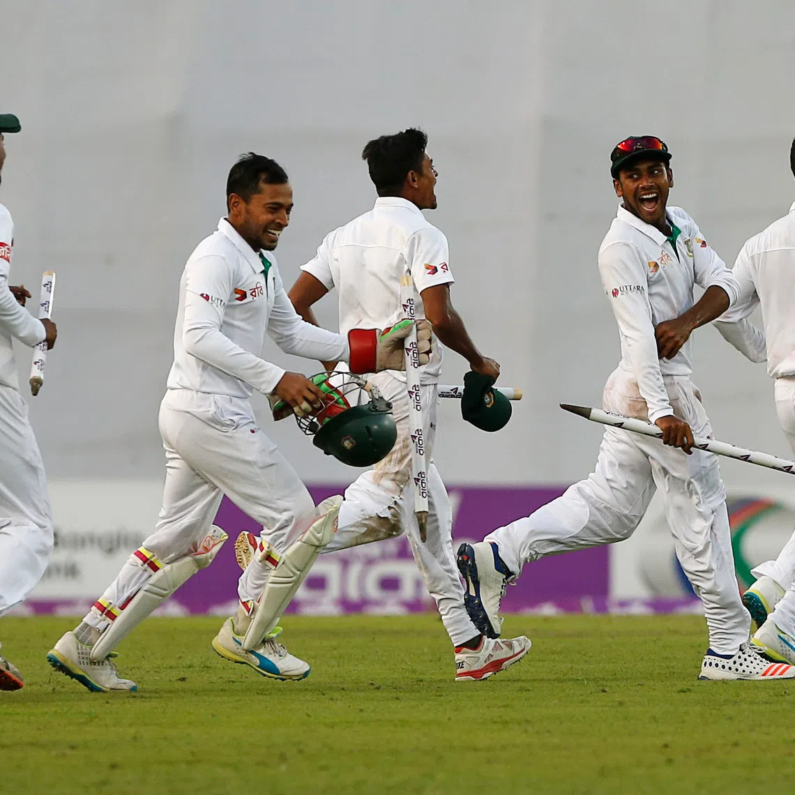 FILE PHOTO: Cricket - Bangladesh v England - Second Test cricket match - Sher-e-Bangla Stadium, Dhaka, Bangladesh - 30/10/16. Bangladesh's players celebrate after winning the match. REUTERS/Mohammad Ponir Hossain/File Photo