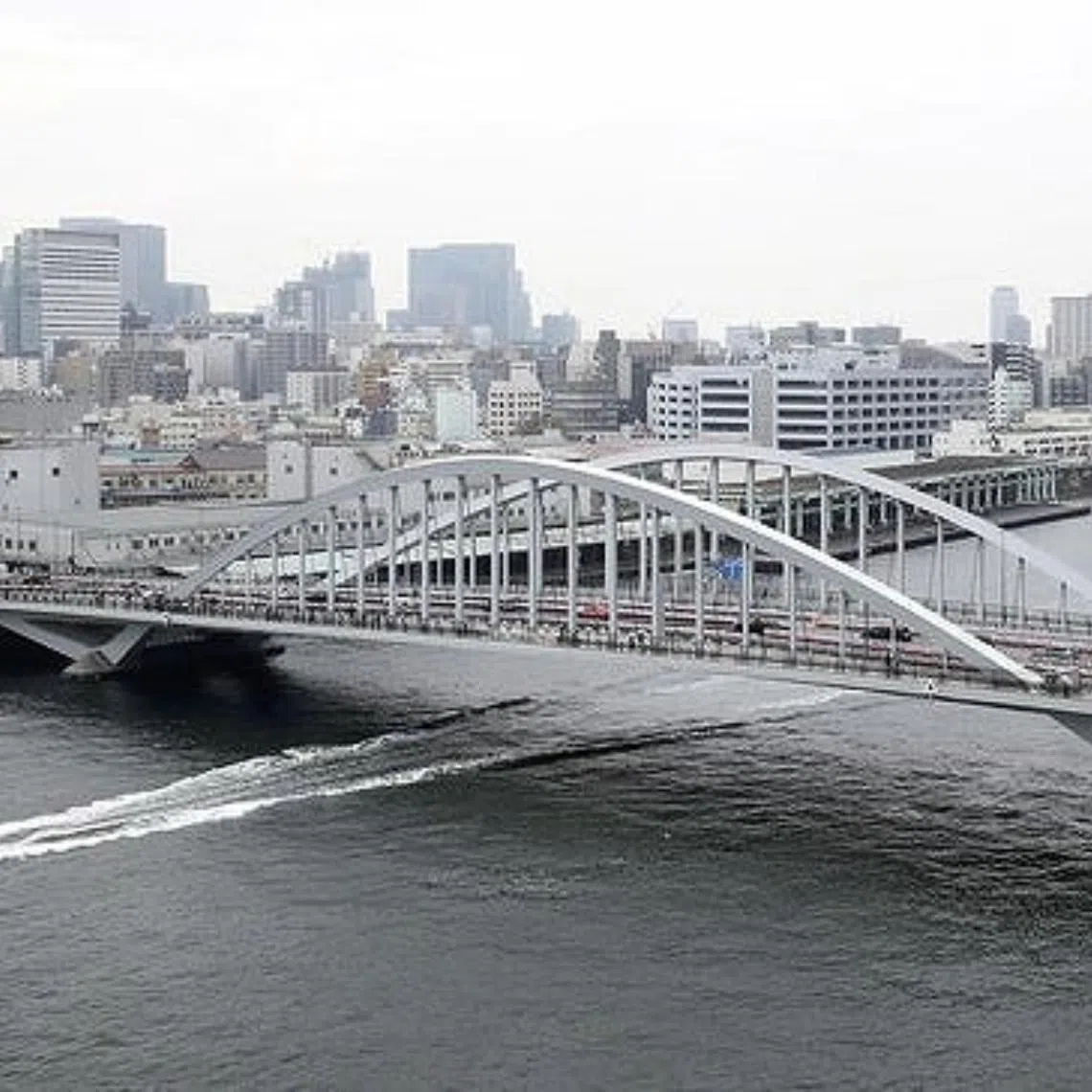 The collisions involved seven cars at Tsukiji Ohashi bridge (above) in Tokyo's Chuo Ward.