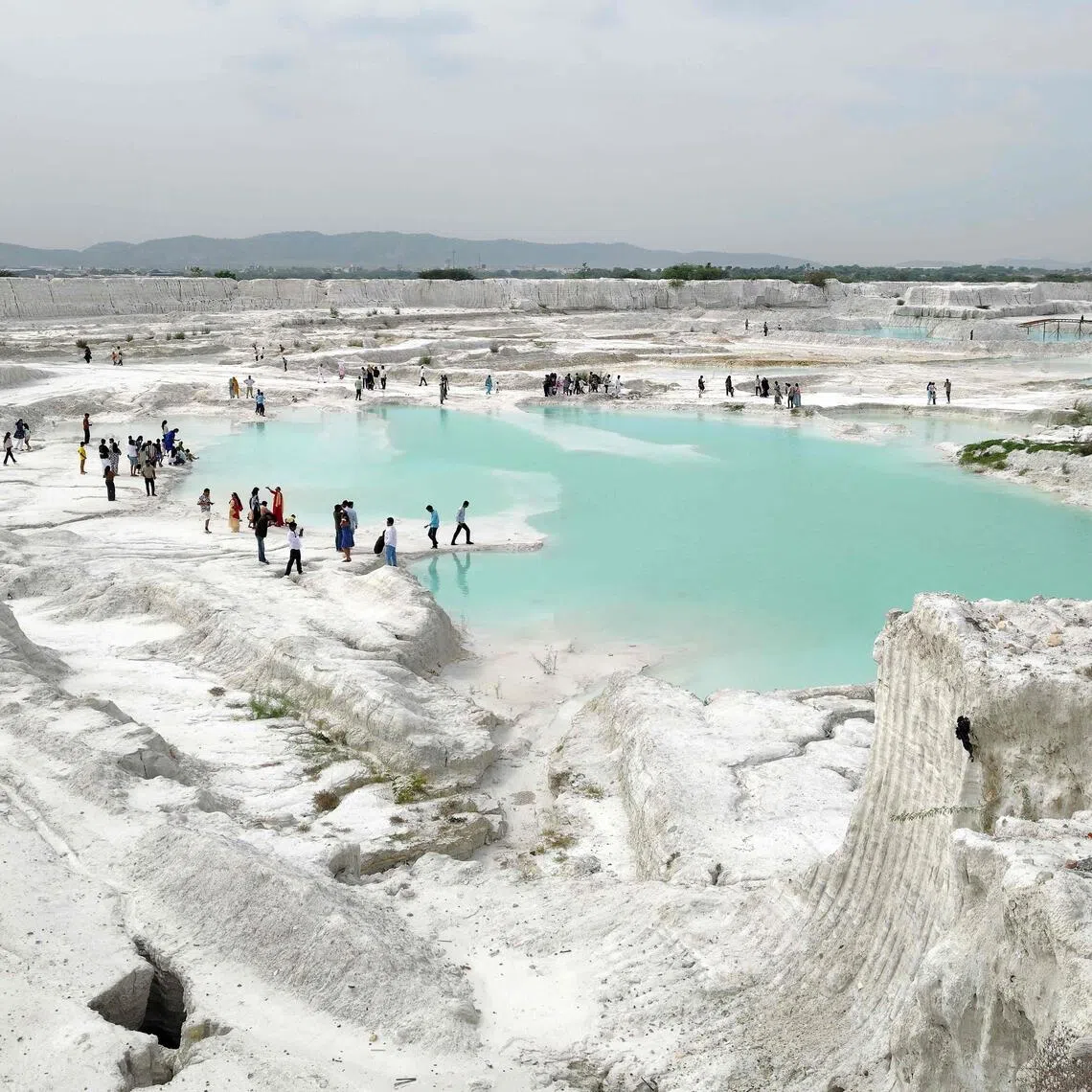 Tourists visit the marble-waste dumping yard in Rajasthan’s Kishangarh city on Aug 16.