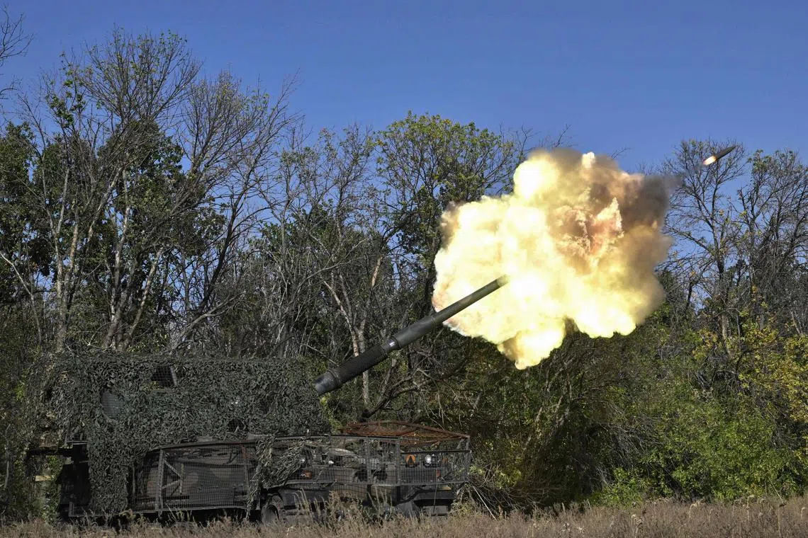Ukrainian servicemen of the 26th artillery brigade fire an AHS Krab self-propelled howitzer toward Russian positions near the front line in the Chasiv Yar area in the Donetsk region on September 30, 2024, amid the Russian invasion of Ukraine. (Photo by Genya SAVILOV / AFP)