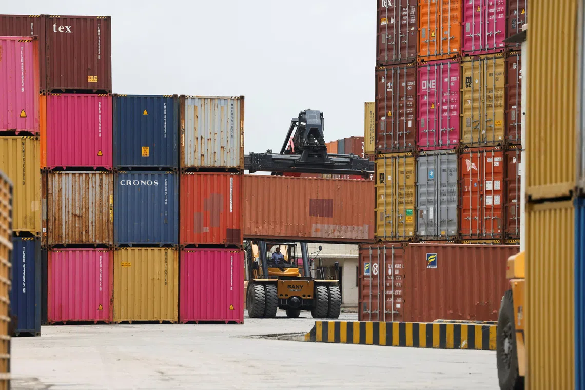 A mobile crane carries a container at the Thar Dry Port in Sanand in the western state of Gujarat, India, July 15, 2026.  REUTERS/Amit Dave