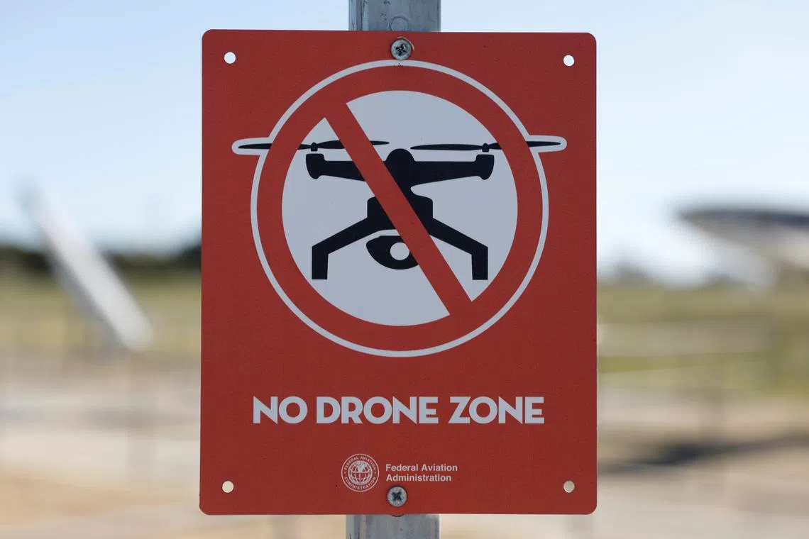 FILE PHOTO: A Federal Aviation Administration (FAA) sign warns against the use of drones, in this illustration. REUTERS/Chris Helgren/File Photo