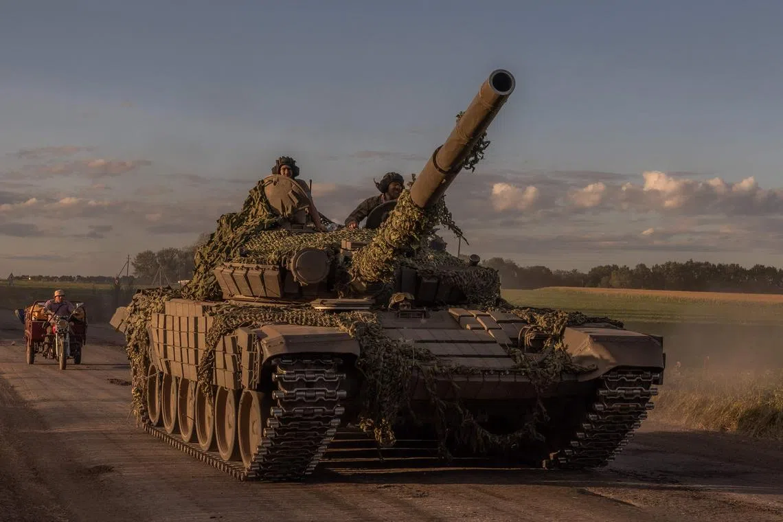Ukrainian servicemen operating a Soviet-made T-72 tank in the Sumy region, near the border with Russia, on Aug 12.