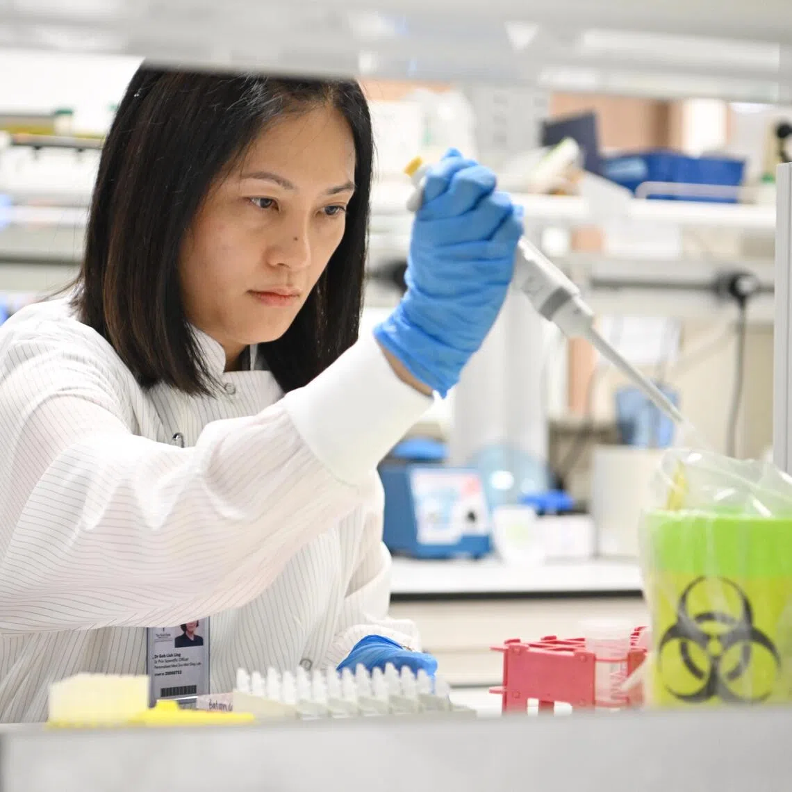 Dr Goh Liuh Ling, laboratory director and senior principal scientific officer at Tan Tock Seng Hospital Centre for Precision and Genomic Medicine carrying out tests on a patient's genes to see how he would react to his medication

ST PHOTO: AZMI ATHNI