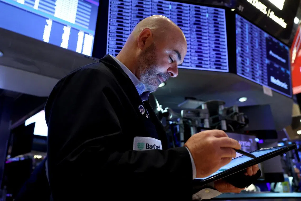 A trader working on the floor of the New York Stock Exchange, in New York City, on Nov 27.