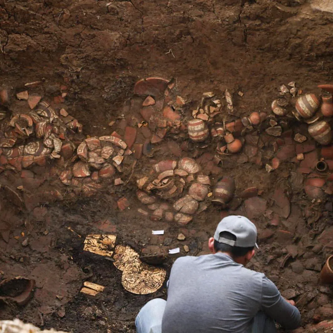 This handout picture released by Panama’s Ministry of Culture shows an archaeologist working inside a pre-Hispanic tomb approximately 1,200 years old, discovered at the El Cano Archaeological Park in Cocle, Panama, on Feb 20, 2026.