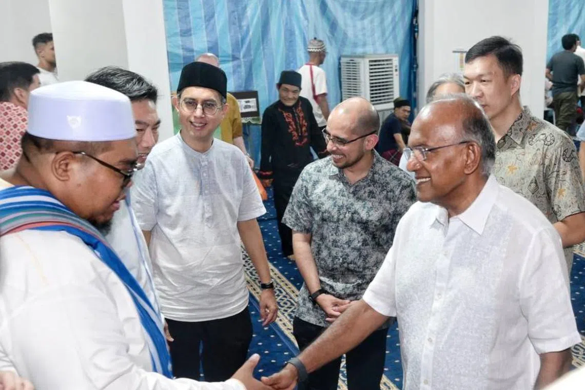 Law minister K Shanmugam along with other Nee Soon advisers, interacting with Yishun residents at 607 Yishun Street 61 on March 27. 