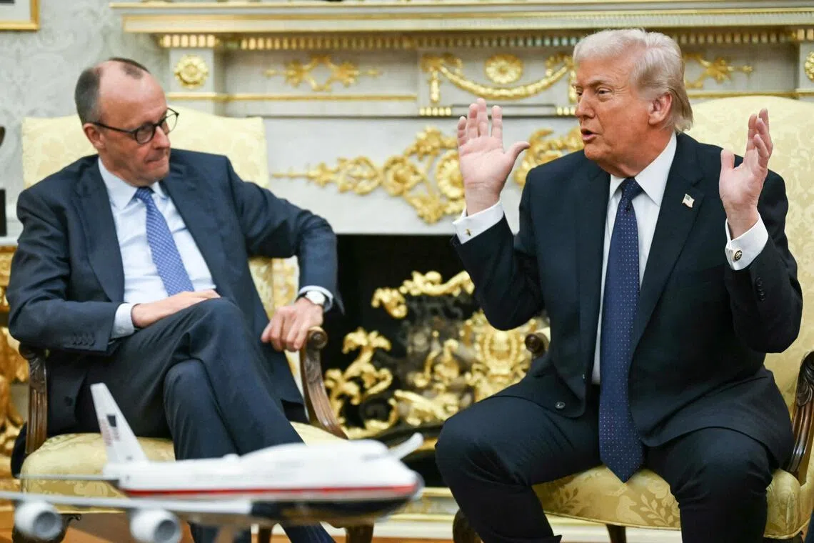 US President Donald Trump speaking to reporters at the White House on March 3, next to visiting German Chancellor Friedrich Merz.