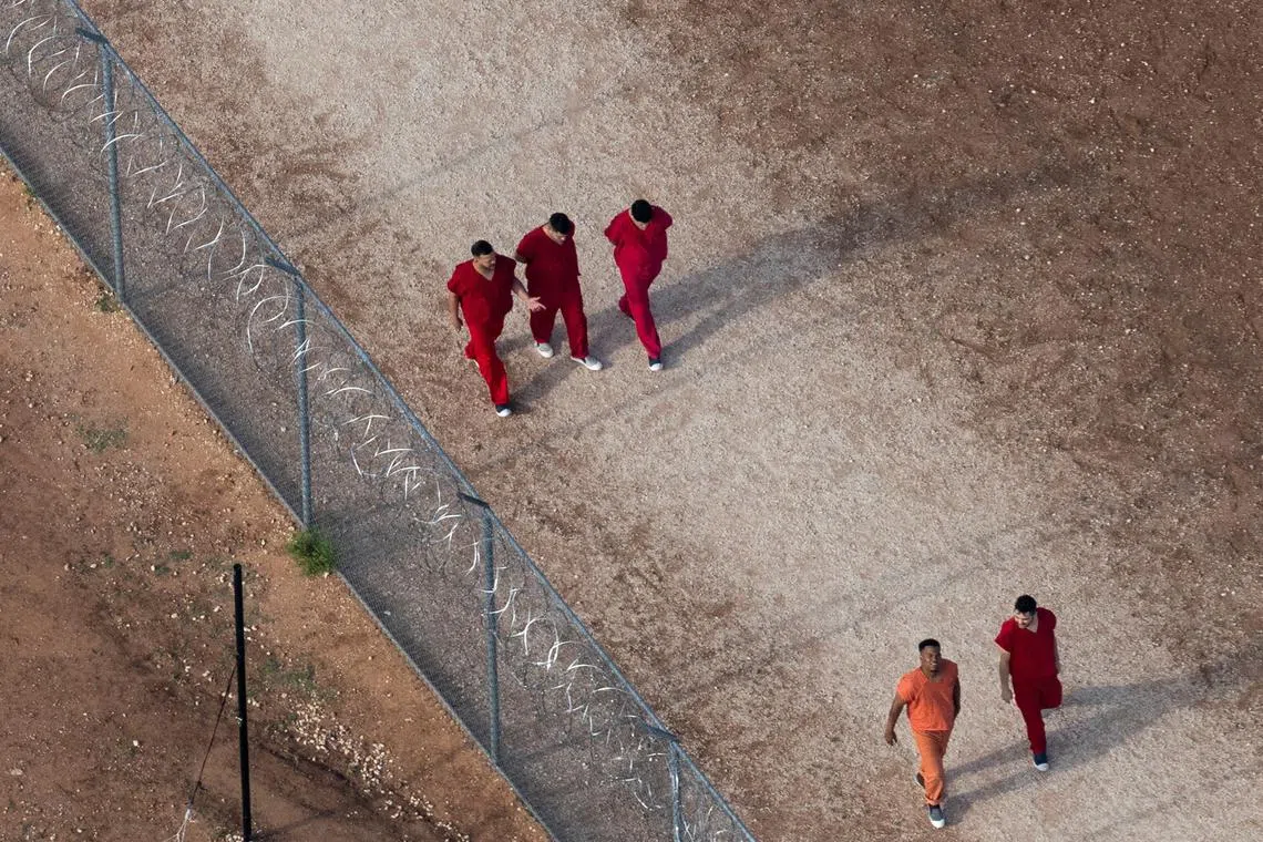 FILE PHOTO: An aerial view shows Diover Millan of Venezuela, top left, and other detainees at the Bluebonnet Detention Facility, the facility where Venezuelans at the center of a U.S. Supreme Court ruling are held, in Anson, Texas, U.S., April 23, 2025. REUTERS/Daniel Cole/File Photo