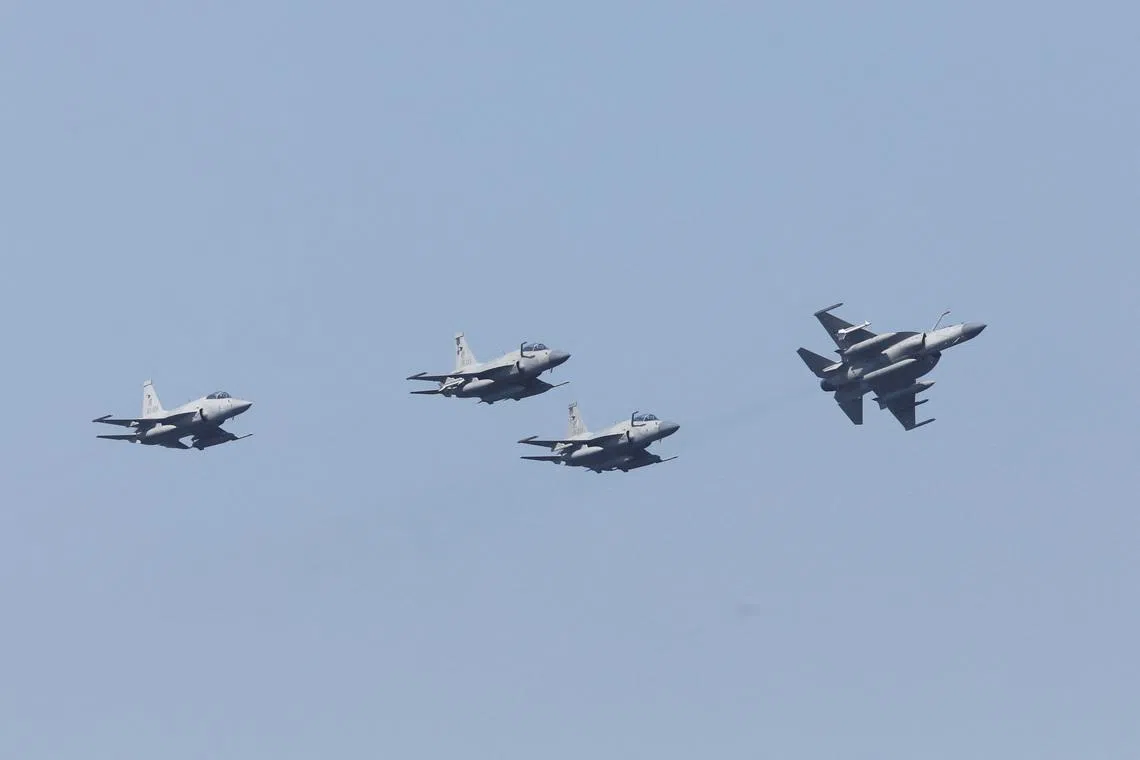 Pakistan Air Force's JF-17 Thunder jets fly past during the sea phase of Pakistan Navy's Multinational Exercise AMAN-23, in the North Arabian Sea near Karachi, Pakistan, February 13, 2023. REUTERS/Akhtar Soomro/File Photo