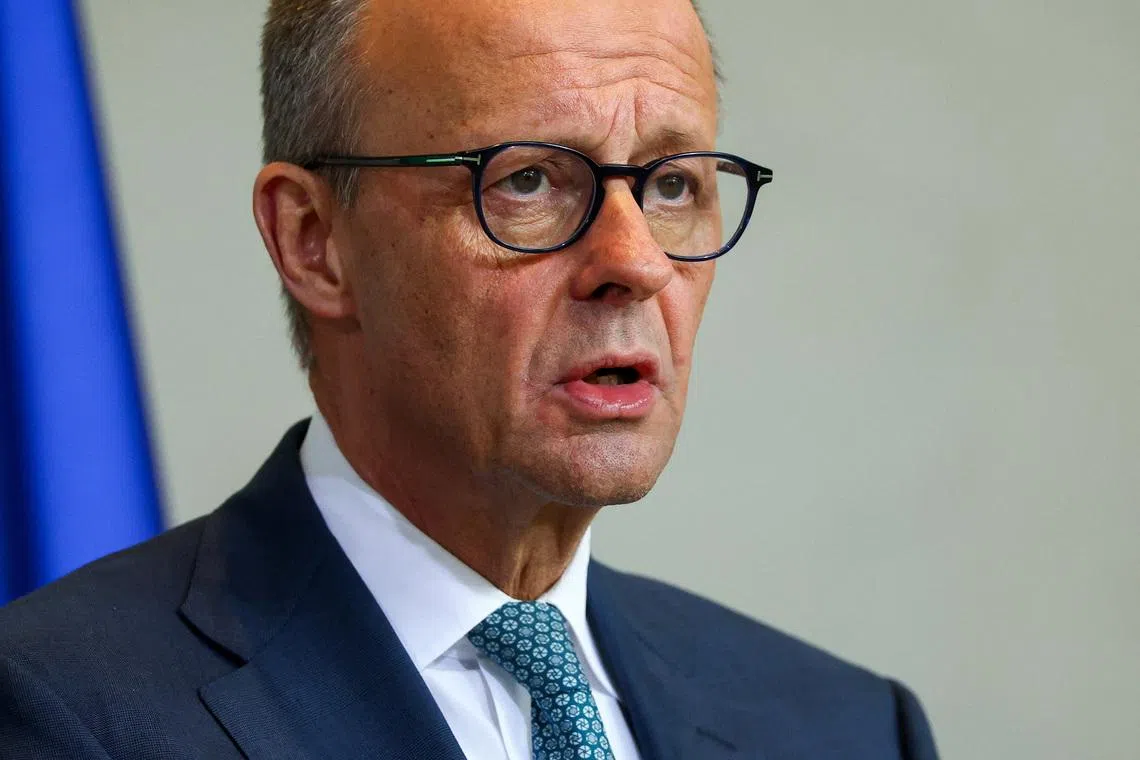 German Chancellor Friedrich Merz speaks during a press conference with Syrian President Ahmed al-Sharaa (not pictured), at the Chancellery, in Berlin, Germany March 30, 2026. REUTERS/Lisi Niesner