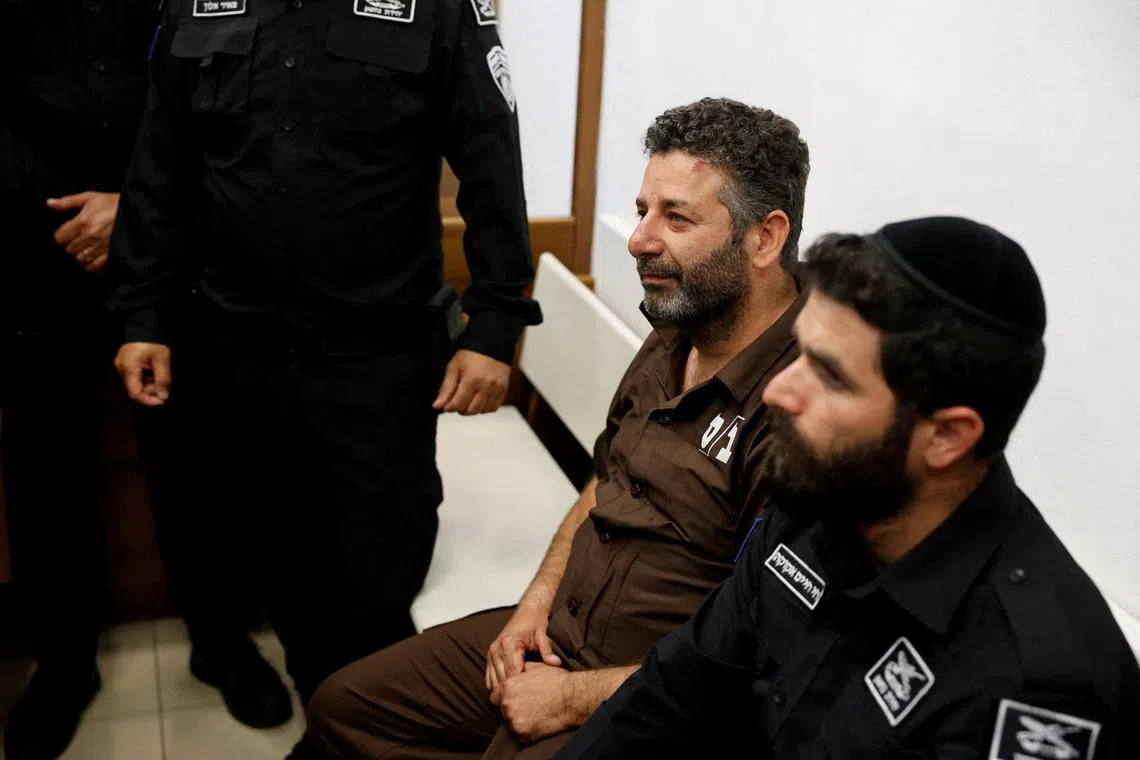 Activist Saif Abu Keshek sits at a magistrate's court for a detention extension hearing in Ashkelon, southern Israel, on May 3.