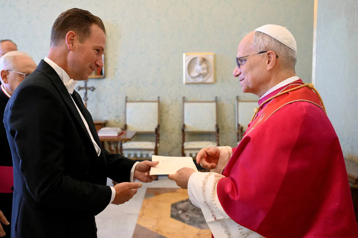 Pope Leo XIV receives the letters of credence from Brian Francis Burch, the new U.S. ambassador to the Holy See, at the Vatican, September 13, 2025.   Vatican Media/­Simone Risoluti/Handout via REUTERS