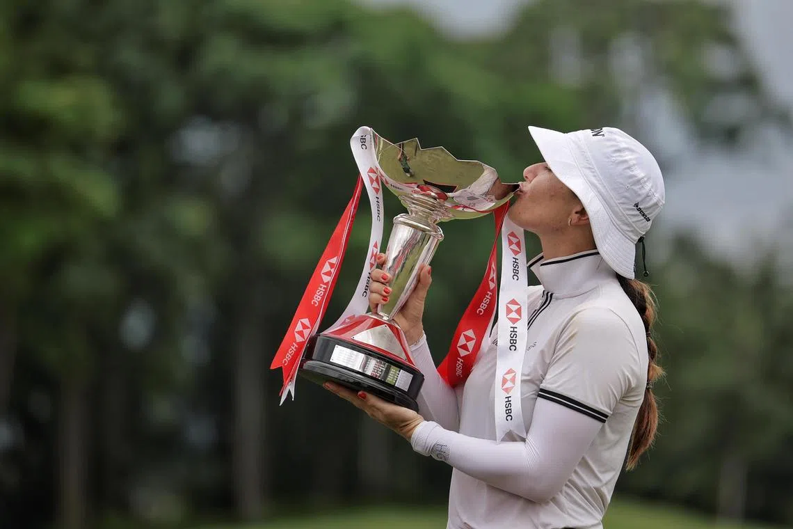 Hannah Green of Australia kissing her trophy after winning the HSBC Women's World Championship.