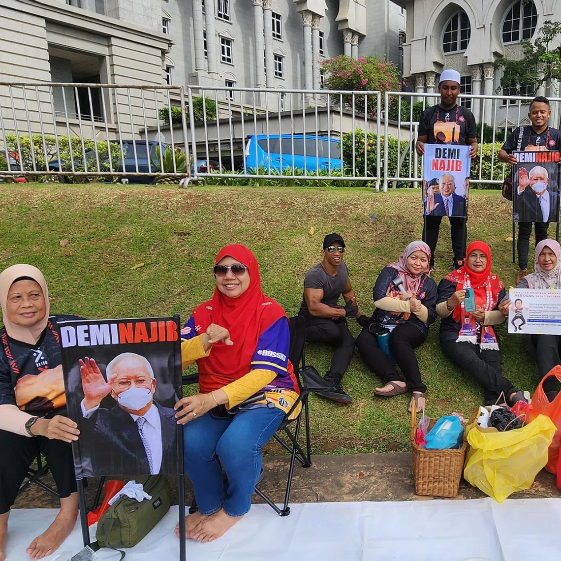 Supporters of Malaysia’s former prime minister Najib Razak gathering on the grounds of the court complex in Putrajaya on Dec 26.