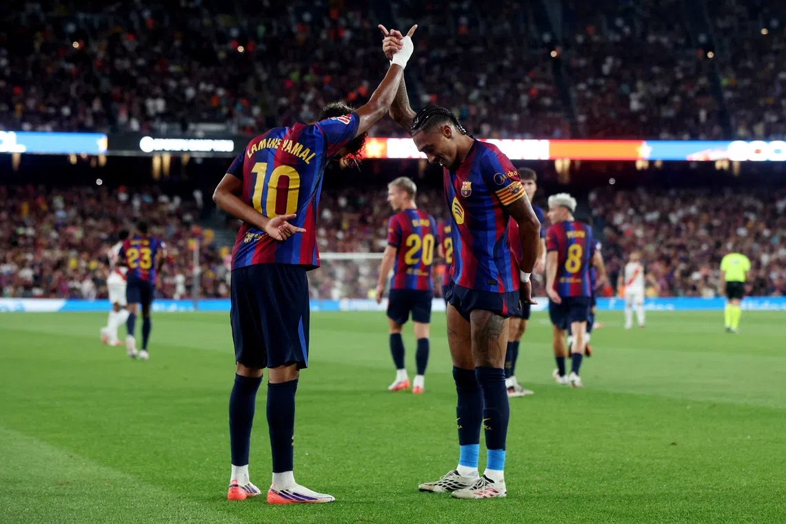 Soccer Football - LaLiga - FC Barcelona v Rayo Vallecano - Spotify Camp Nou, Barcelona, Spain - August 31, 2026 FC Barcelona's Lamine Yamal celebrates scoring their second goal with Raphinha REUTERS/Bruna Casas