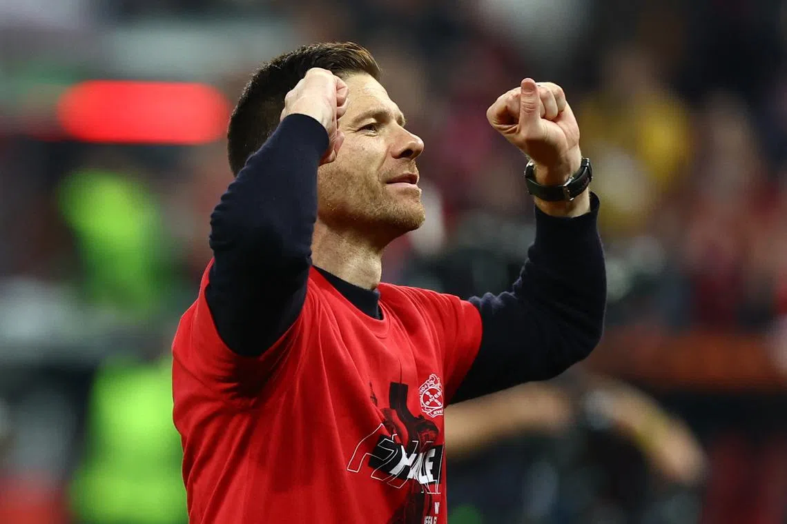 Soccer Football - Europa League - Semi Final - Second Leg - Bayer Leverkusen v AS Roma - BayArena, Leverkusen, Germany - May 9, 2024 Bayer Leverkusen coach Xabi Alonso celebrates after the match REUTERS/Kai Pfaffenbach