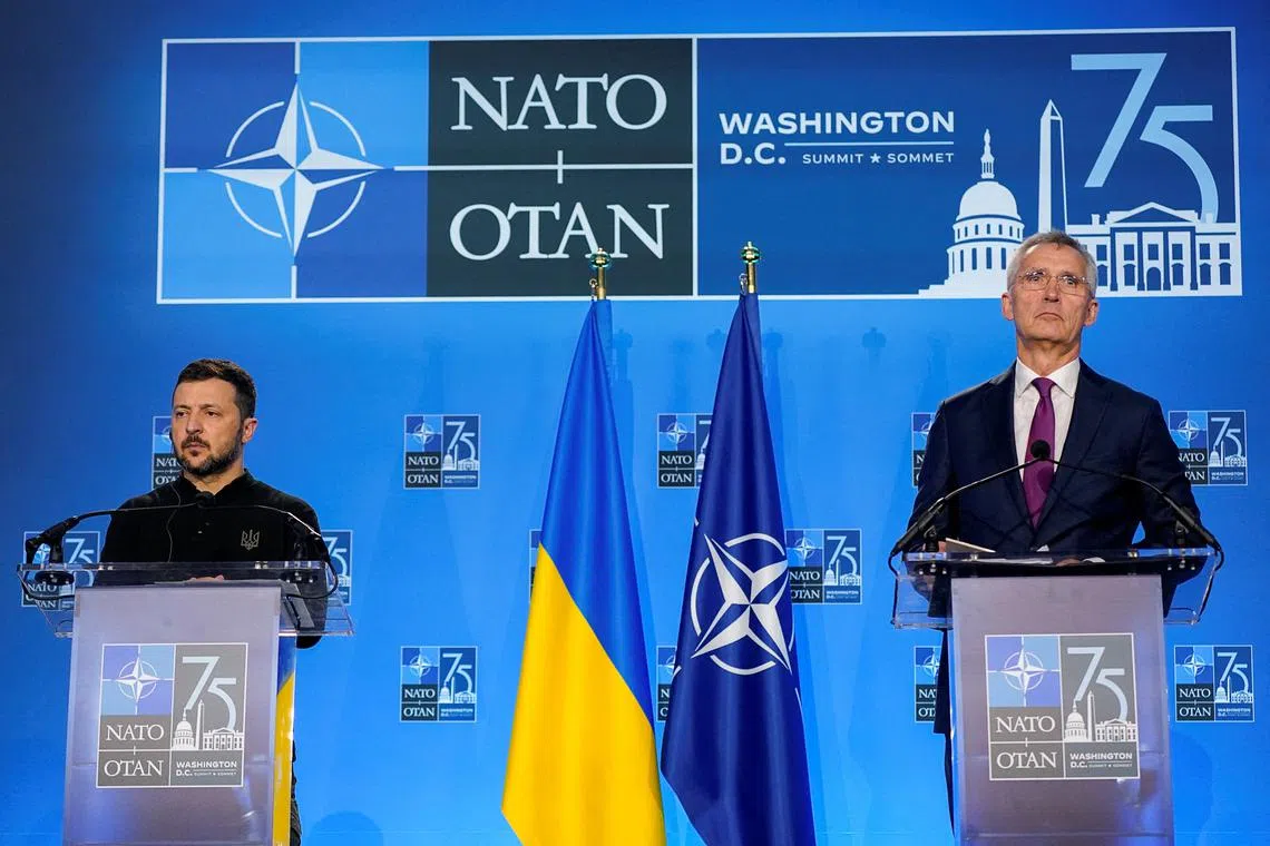 FILE PHOTO: Ukraine's President Volodymyr Zelenskiy and NATO Secretary General Jens Stoltenberg attend a press conference, during NATO's 75th anniversary summit, in Washington, U.S., July 11, 2024. REUTERS/Nathan Howard/File Photo