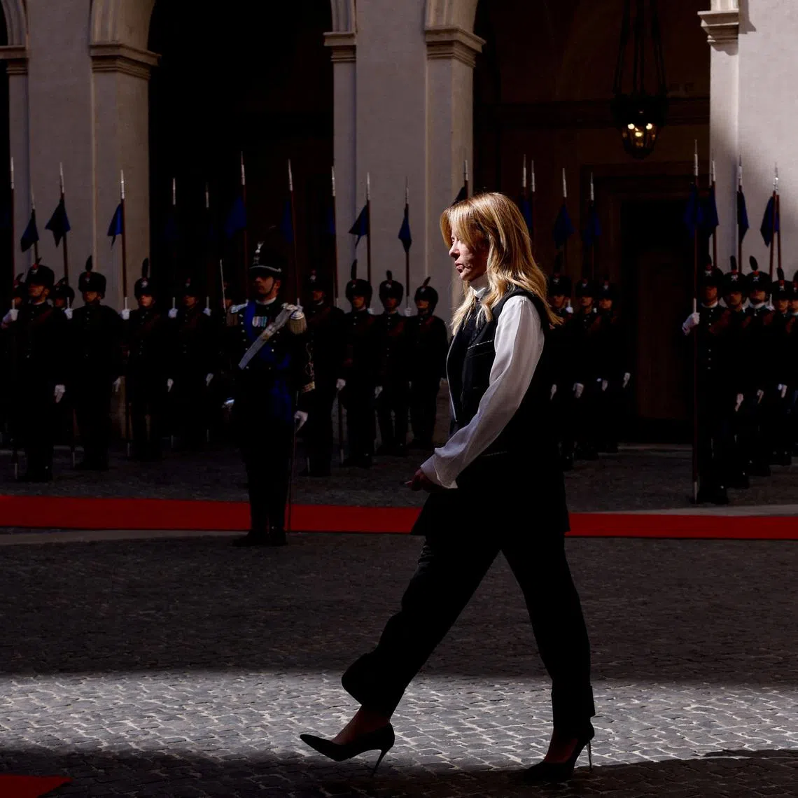 FILE PHOTO: Italian Prime Minister Giorgia Meloni walks ahead of a meeting with Kenya's President William Ruto at Chigi Palace, in Rome, Italy, April 20, 2026. REUTERS/Remo Casilli/File Photo