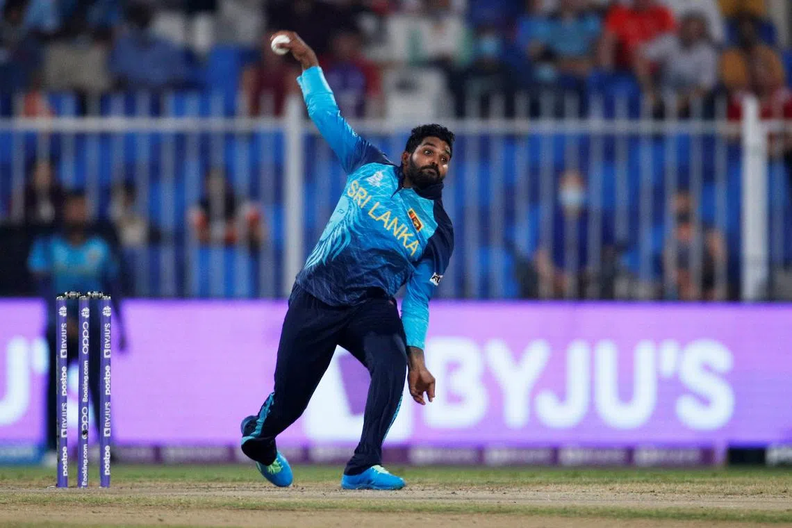 FILE PHOTO: Cricket - ICC Men's T20 World Cup - Super 12 - Group 1 - England v Sri Lanka - Sharjah Cricket Stadium, Sharjah, United Arab Emirates - November 1, 2021 Sri Lanka's Wanindu Hasaranga de Silva in action REUTERS/Hamad I Mohammed/File Photo