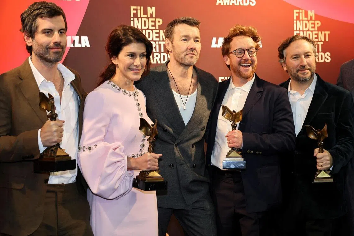 (From left) Brazilian cinematographer Adolpho Veloso, producer Marissa McMahon, Australian actor Joel Edgerton, director Clint Bentley and producer Teddy Schwarzman pose with the awards for Train Dreams during the Film Independent Spirit Awards on Feb 15.