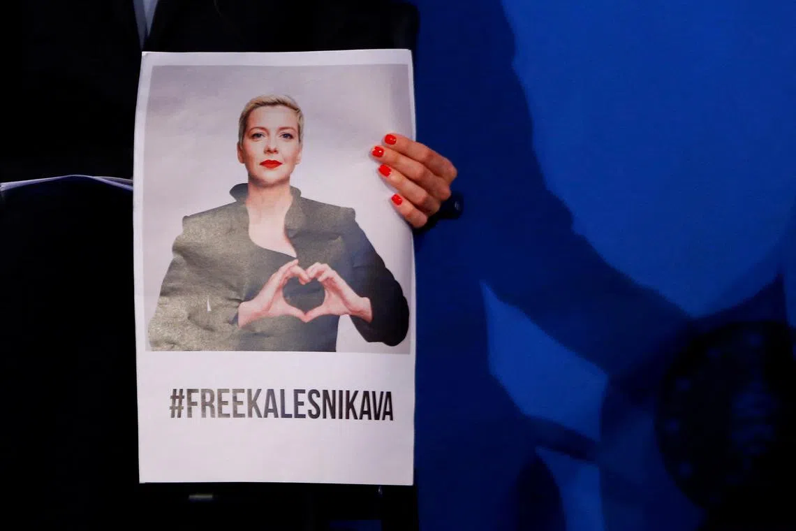 FILE PHOTO: Belarusian civil rights activist Tatsiana Khomich holds a picture of of her detained sister Maria Kalesnikava as she attends the ceremony for presenting the Charlemagne Prize (Karlspreis), on behalf of her sister, during the ceremony in Aachen, Germany, May 26, 2022. REUTERS/Thilo Schmuelgen/File Photo