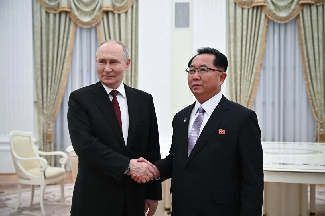 Russian President Vladimir Putin (left) and member of North Korea's Workers' Party Central Committee Politburo Ri Hi Yong meet in Moscow, Russia.