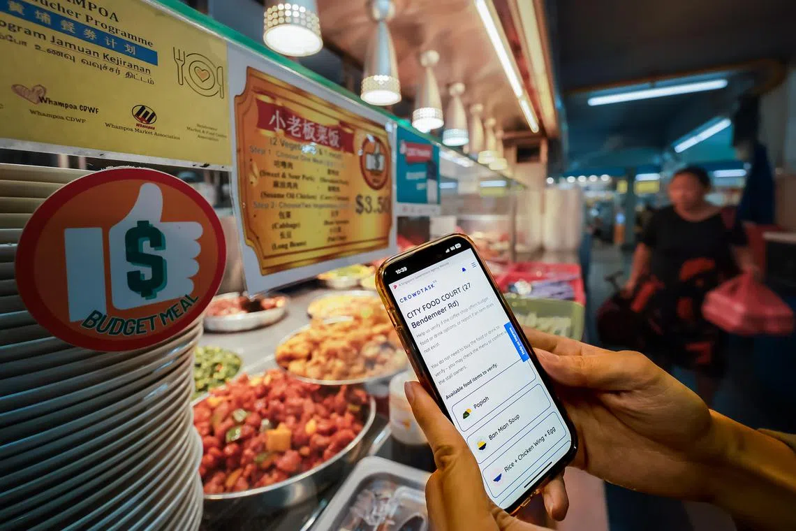 A man using his mobile phone to add a food stall that offer budget meal options to the BudgetMealGoWhere website list while visiting City Foodcourt at Bendemeer Road, Jan 16, 2024.