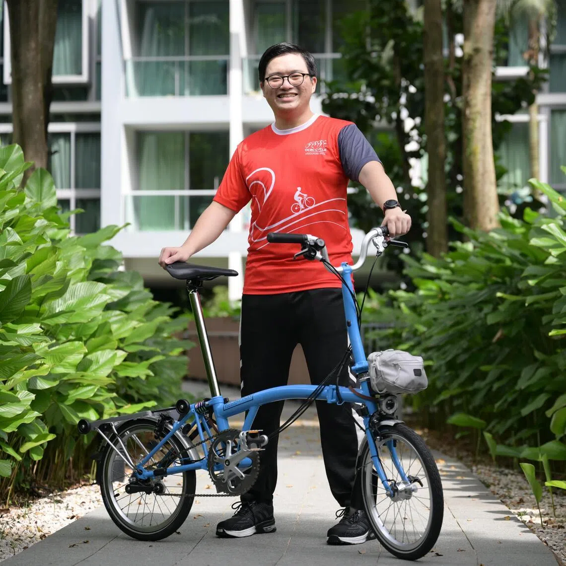 Bicycle enthusiast Jason Loo with the Brompton C Line bike that he won as part of a giveaway contest organised by the OCBC Cycle and The Straits Times.