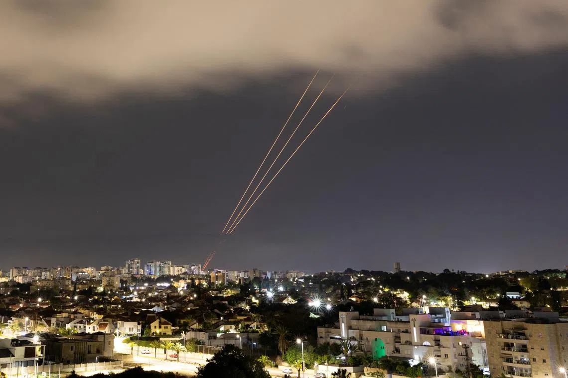 An anti-missile system operates after Iran launched drones and missiles towards Israel, as seen from Ashkelon, Israel April 14, 2024. REUTERS/Amir Cohen