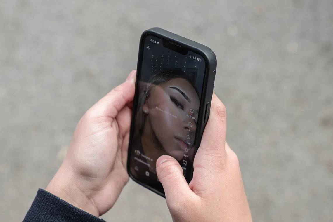 A 14-year-old checks social media posts, as Greece is set to ban under-15s from social media in European crackdown, in Athens, Greece, February 26, 2026. REUTERS/Louisa Gouliamaki