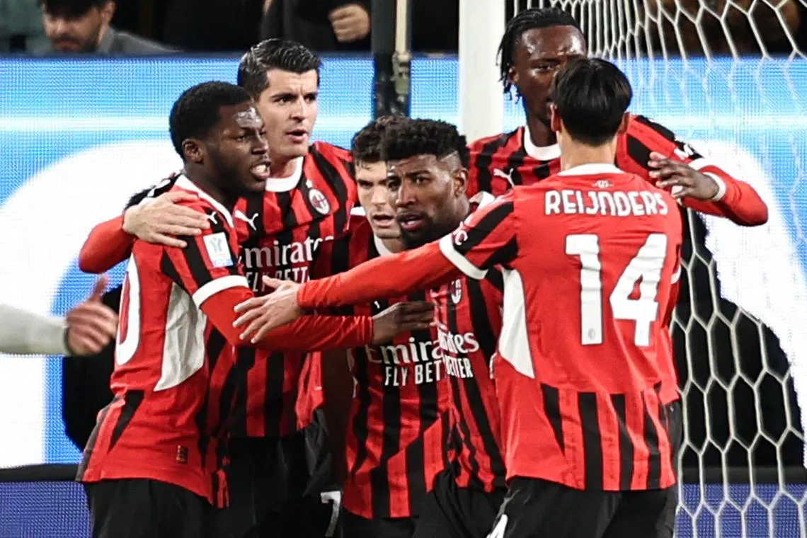AC Milan's players celebrate after their US forward Christian Pulisic scored the equaliser against Juventus.