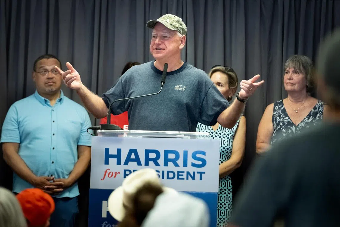 Governor Tim Walz of Minnesota, who joined the Army National Guard two days after his 17th birthday, speaks at a Kamala Harris for president rally on July 27 before she selected him as the vice-presidential nominee. Almost all of the members of his Army National Guard unit remain unstinting supporters of Mr Walz, but Minnesota Republicans and JD Vance, former president Donald Trump's running mate, have criticised the governor for retiring from the army the year before his artillery battalion deployed to Iraq. 