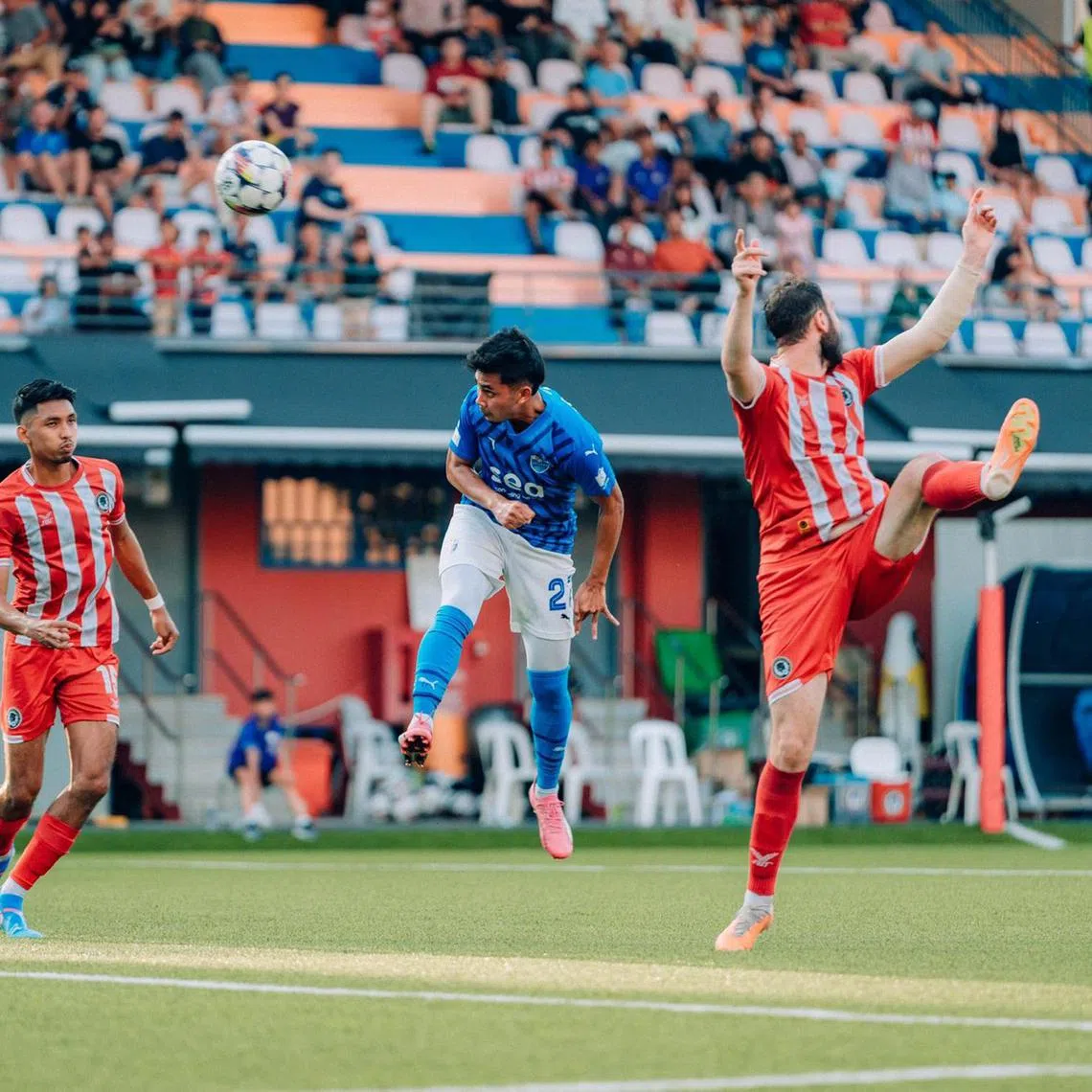 Lion City Sailors' Adam Swandi heading in their second goal against Tanjong Pagar United in their Singapore Premier League match at the Jurong East Stadium on Sept 14.
