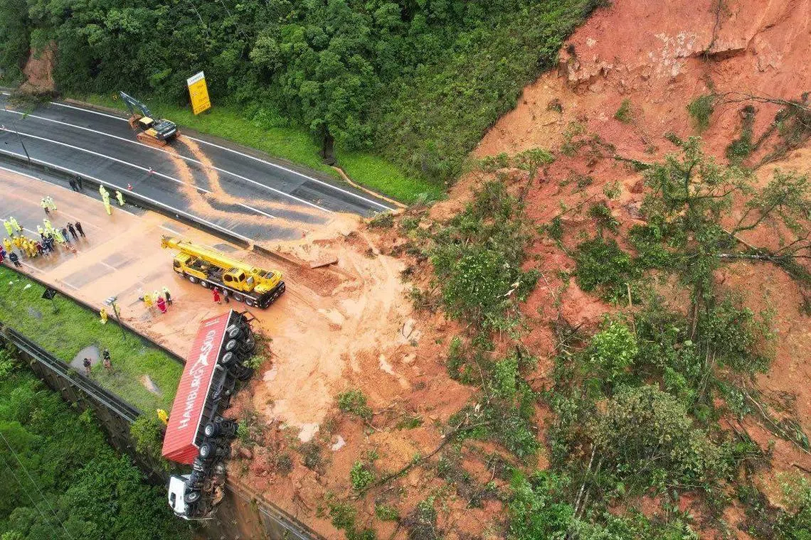 Dozens of people are missing after a landslide swept away some 20 vehicles on a highway in Brazil.