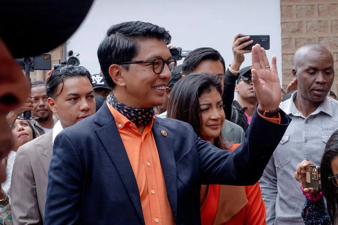 Madagascar's President and a presidential candidate Andry Rajoelina flanked by his wife Mialy Rajoelina as he arrives to cast his ballot at a polling station, during the presidential election in Ambatobe, Antananarivo, Madagascar November 16, 2023. REUTERS/Zo Andrianjafy/ File Photo