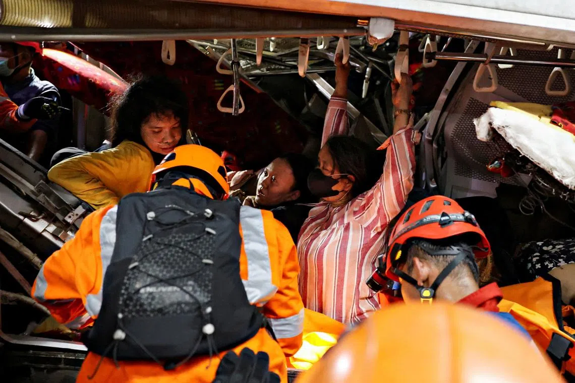 Emergency personnel rescue victims trapped in the damaged train after two trains collided late on Monday in the city of Bekasi, West Java province, Indonesia, April 27, 2026. REUTERS/Ajeng Dinar Ulfiana TPX IMAGES OF THE DAY