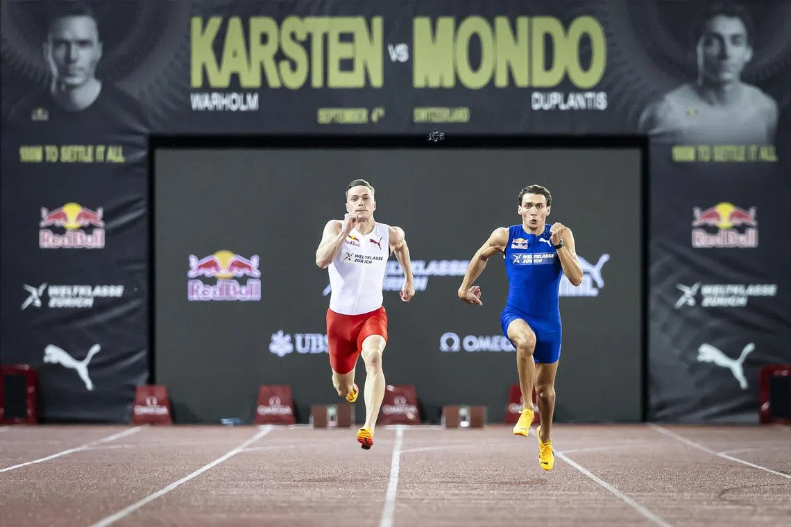 Armand Duplantis (in blue) of Sweden competing in the 100 metres against Norway's Karsten Warholm in Zurich on Sept 4.