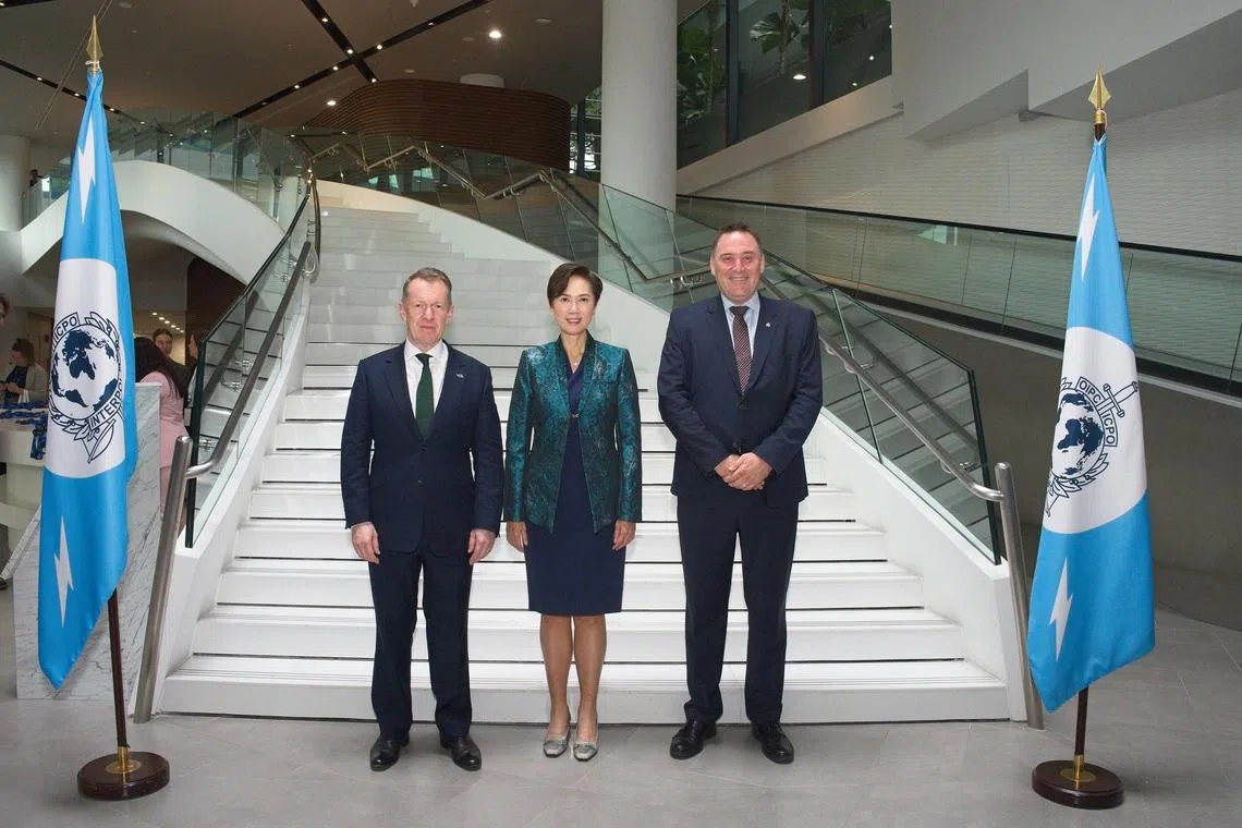 Second Minister for Home Affairs Josephine Teo, flanked by (left) Mr Stephen Kavanagh, executive director of police services at Interpol, and Mr Craig Jones, Interpol’s cybercrime director.
