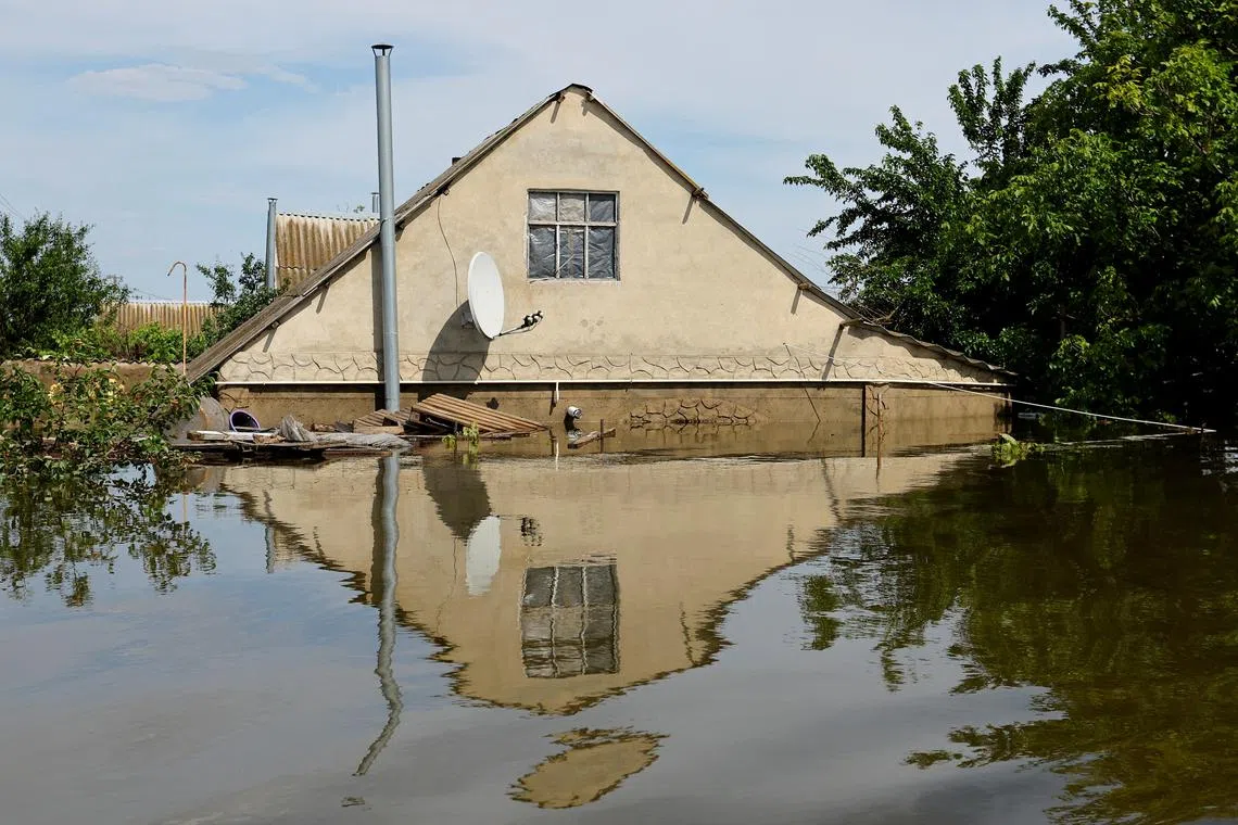 A view shows a house submerged in water following the collapse of the Nova Kakhovka dam, in the settlement of Korsunka, in the Kherson region, Ukraine, June 7, 2023. 
