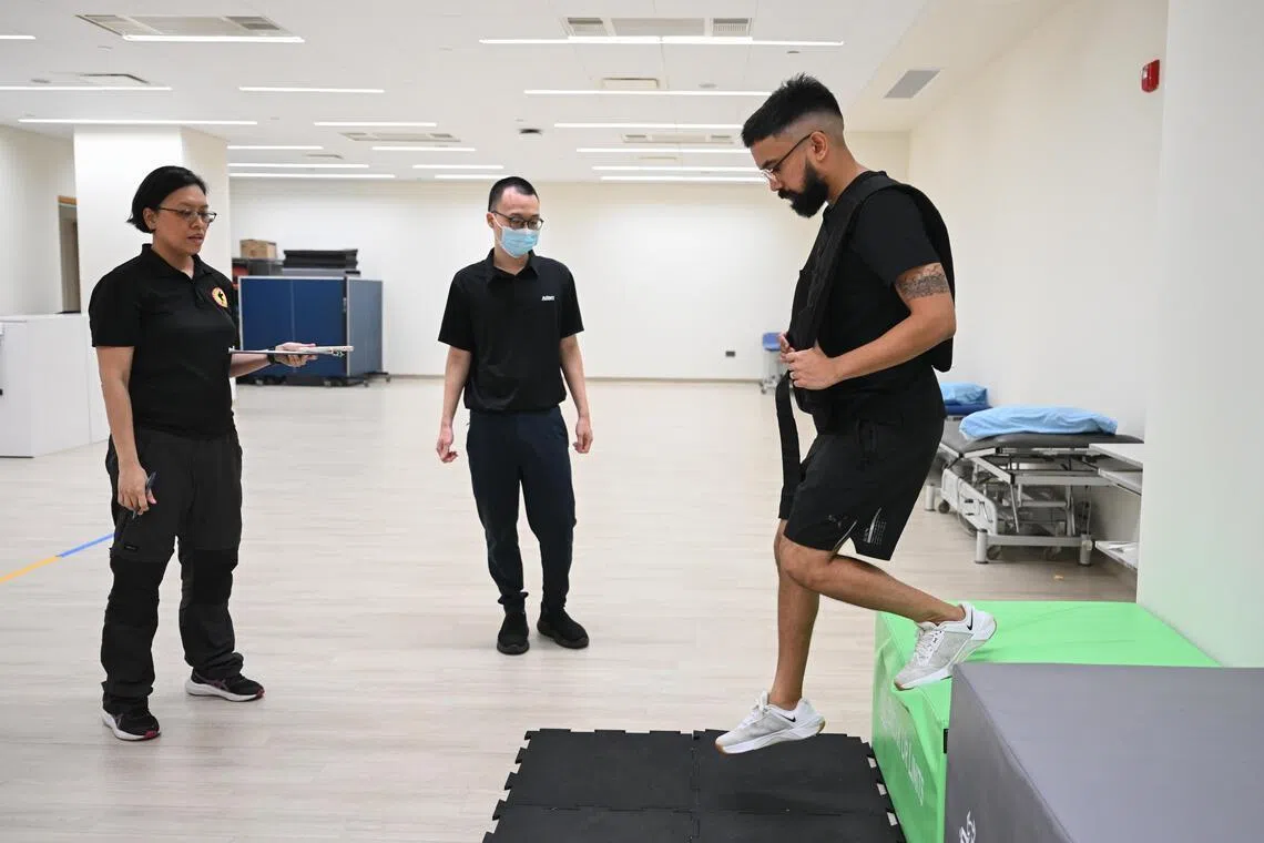 ST correspondent Samuel Devaraj undergoing a landing from height test, as part of the functional test which selected pre-enlistees undergo to assess their ability to carry out specific tasks.