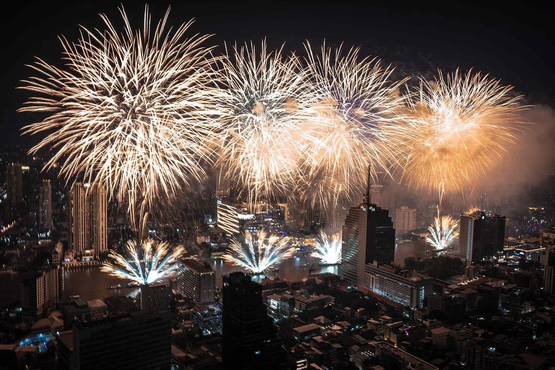 Fireworks lighting up over the Chao Phraya River during the New Year's Day celebrations in Bangkok on Jan 1, 2026. 