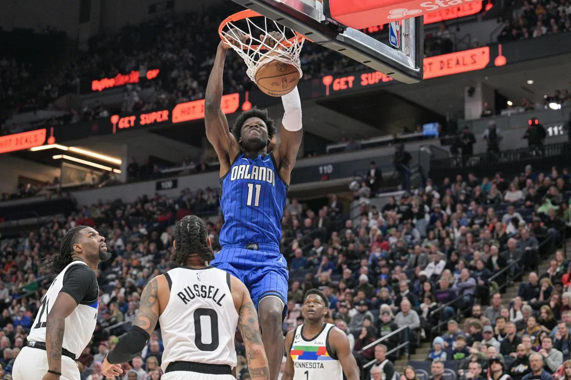 Orlando Magic centre Mo Bamba dunks during the game against the Minnesota Timberwolves. He was later tossed for sparking a brawl.