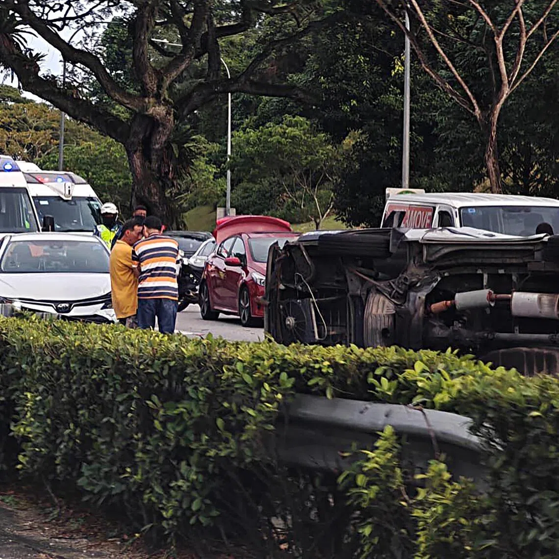 The accident appears to have blocked two lanes, with vehicles having to pass by on the leftmost lane, causing a buildup of traffic.